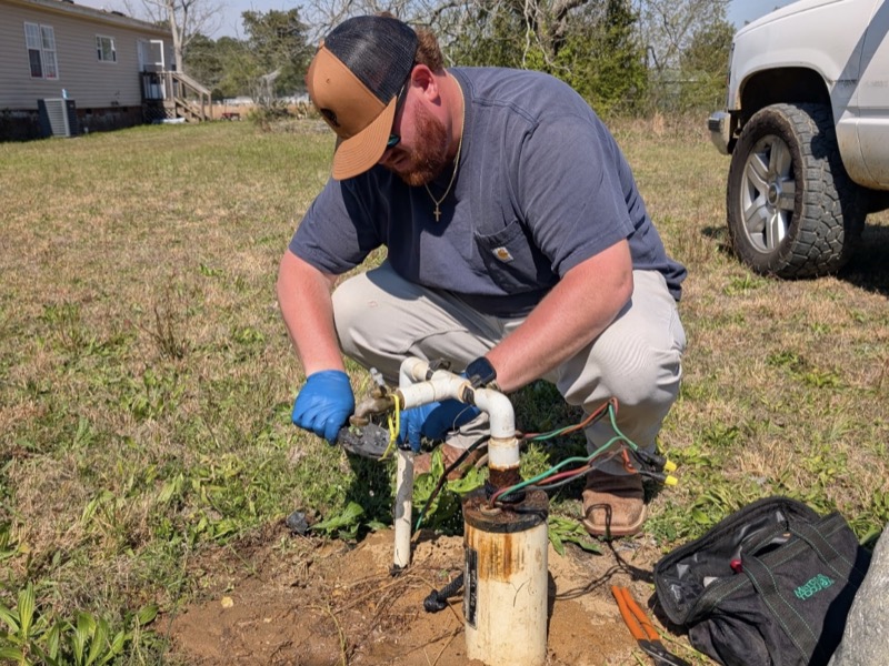 Sellers Well Service technician restoring water at a residential wellhead